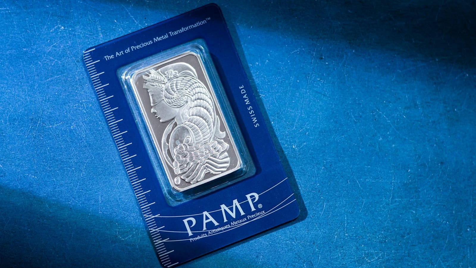 Gold, silver slide as dollar and inflation bite hard